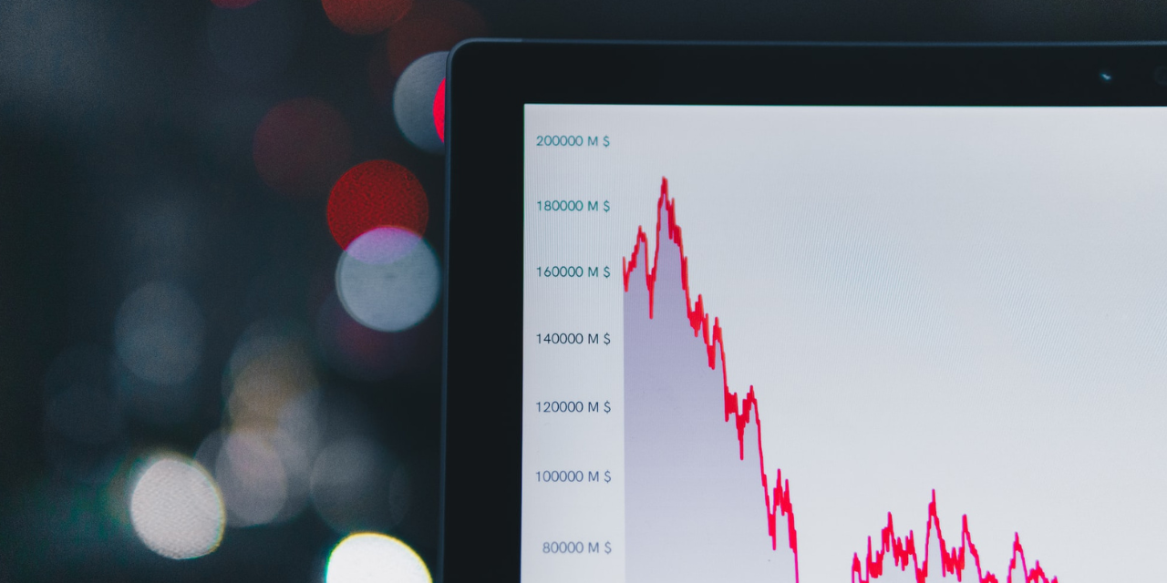 A laptop screen showing an investment chart